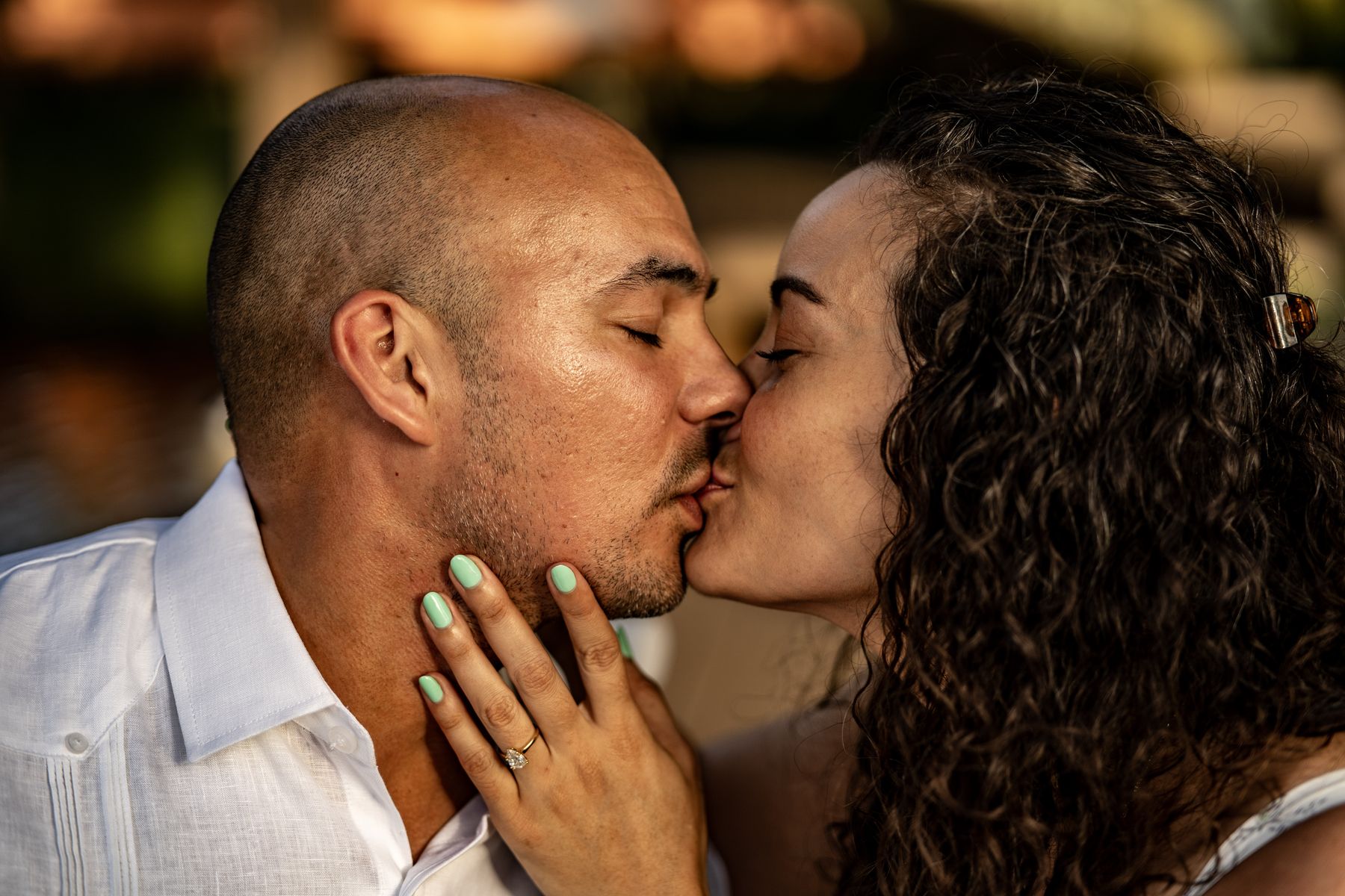 Couple kissing beside a lake